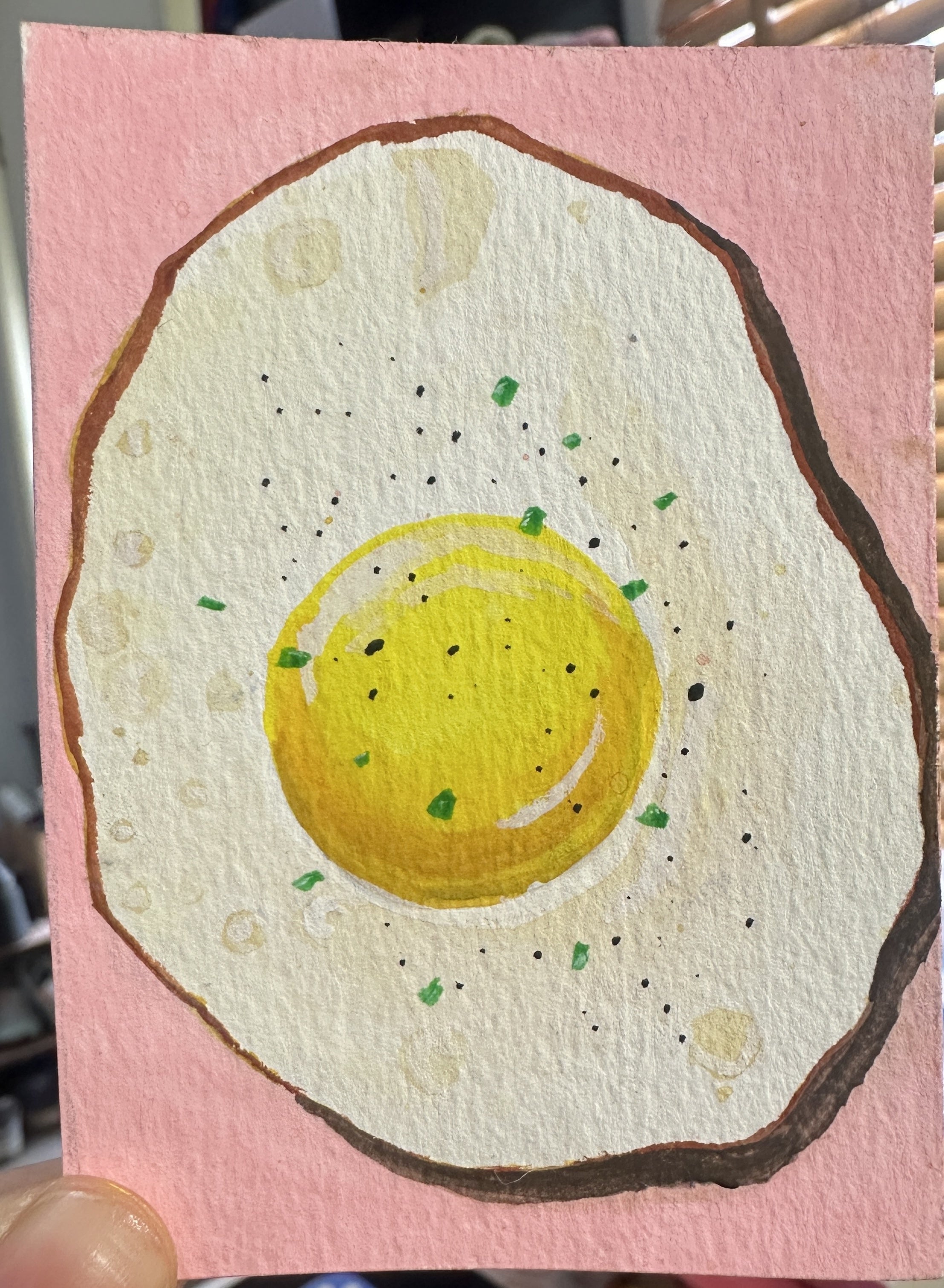 Original ACEO watercolor and gouache painting of a fried egg on a pink background