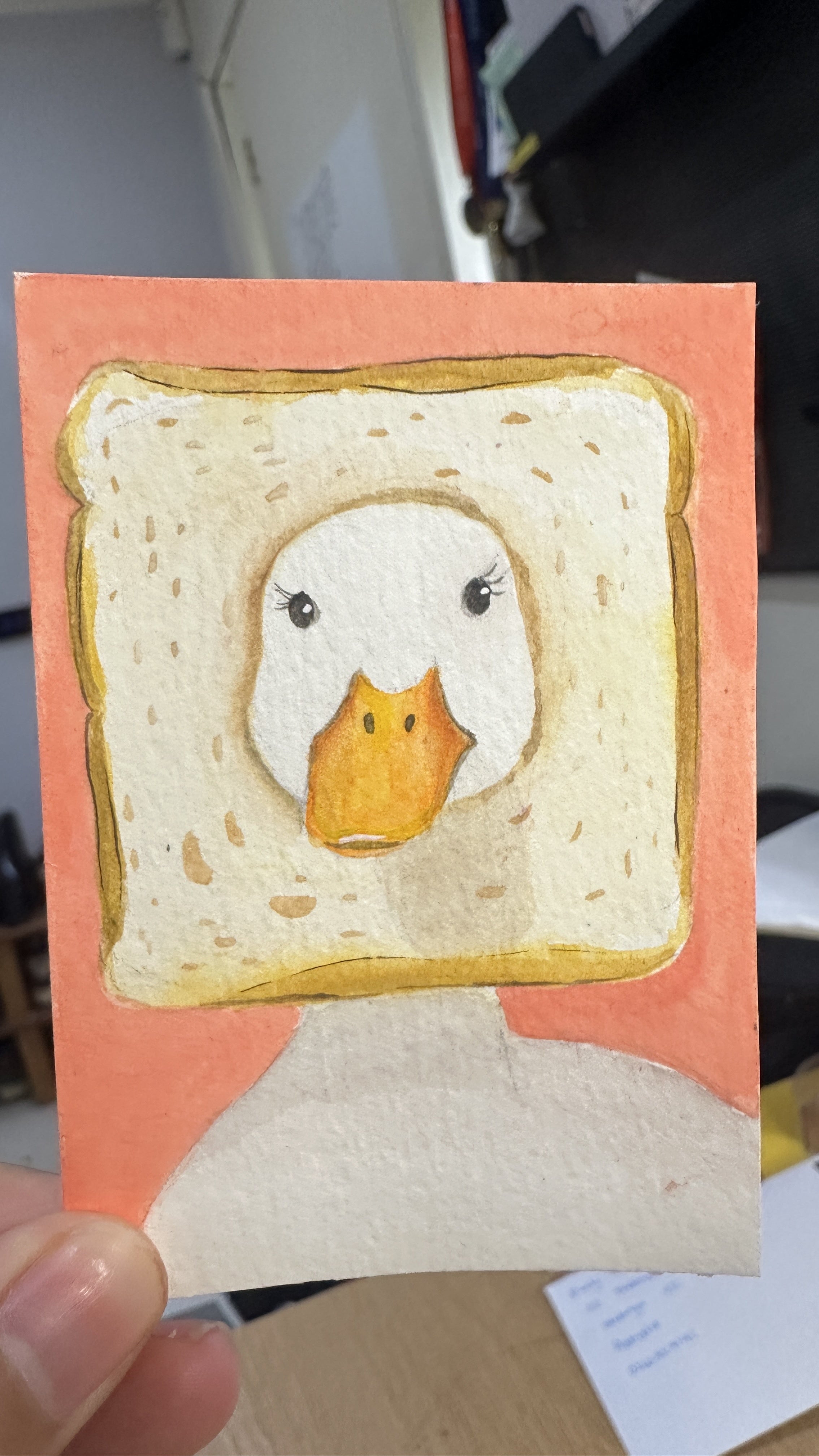 Original ACEO watercolor and gouache painting of a duck head poking through a slice of toast