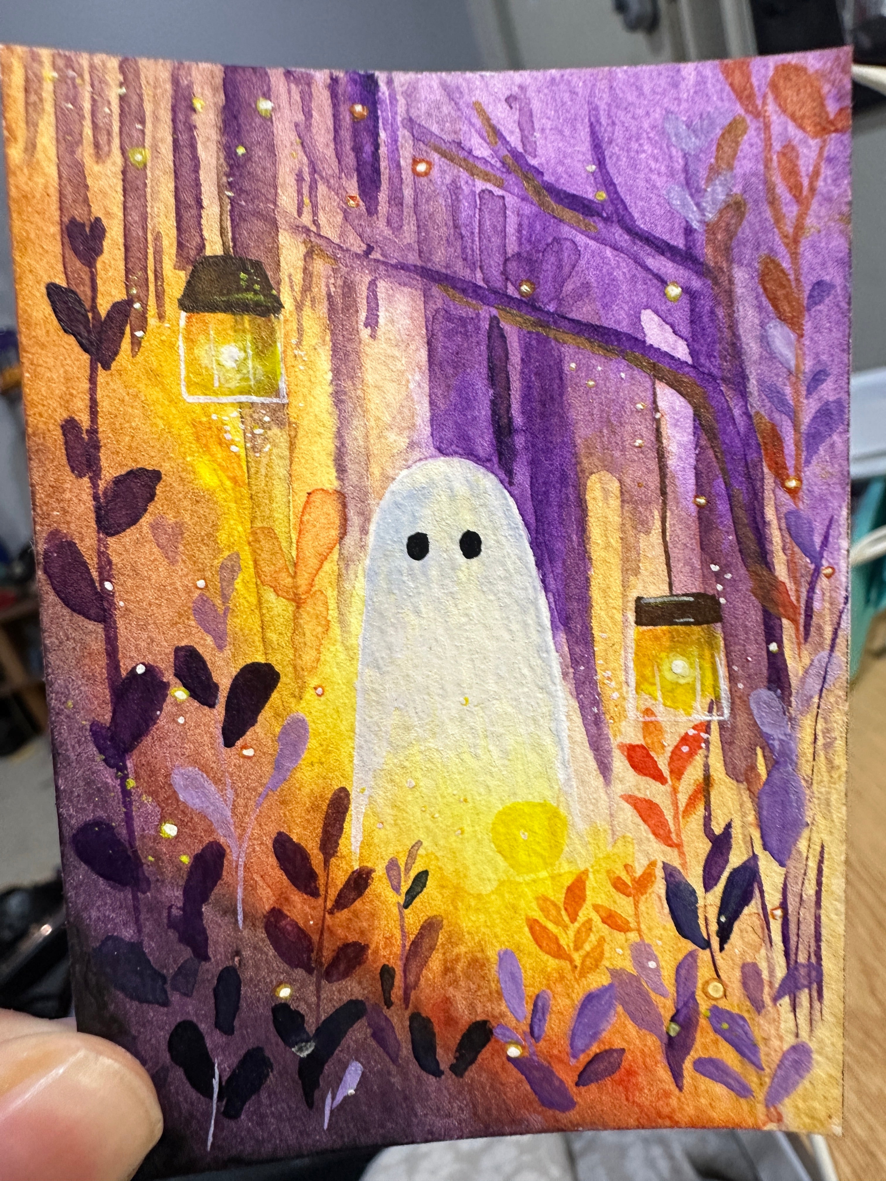 Original ACEO watercolor and gouache painting of a cute ghost in a glowing purple and orange autumn forest with hanging lanterns