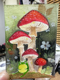 Original ACEO watercolor and gouache painting of a frog sitting beneath red-and-white toadstool mushrooms in a forest
