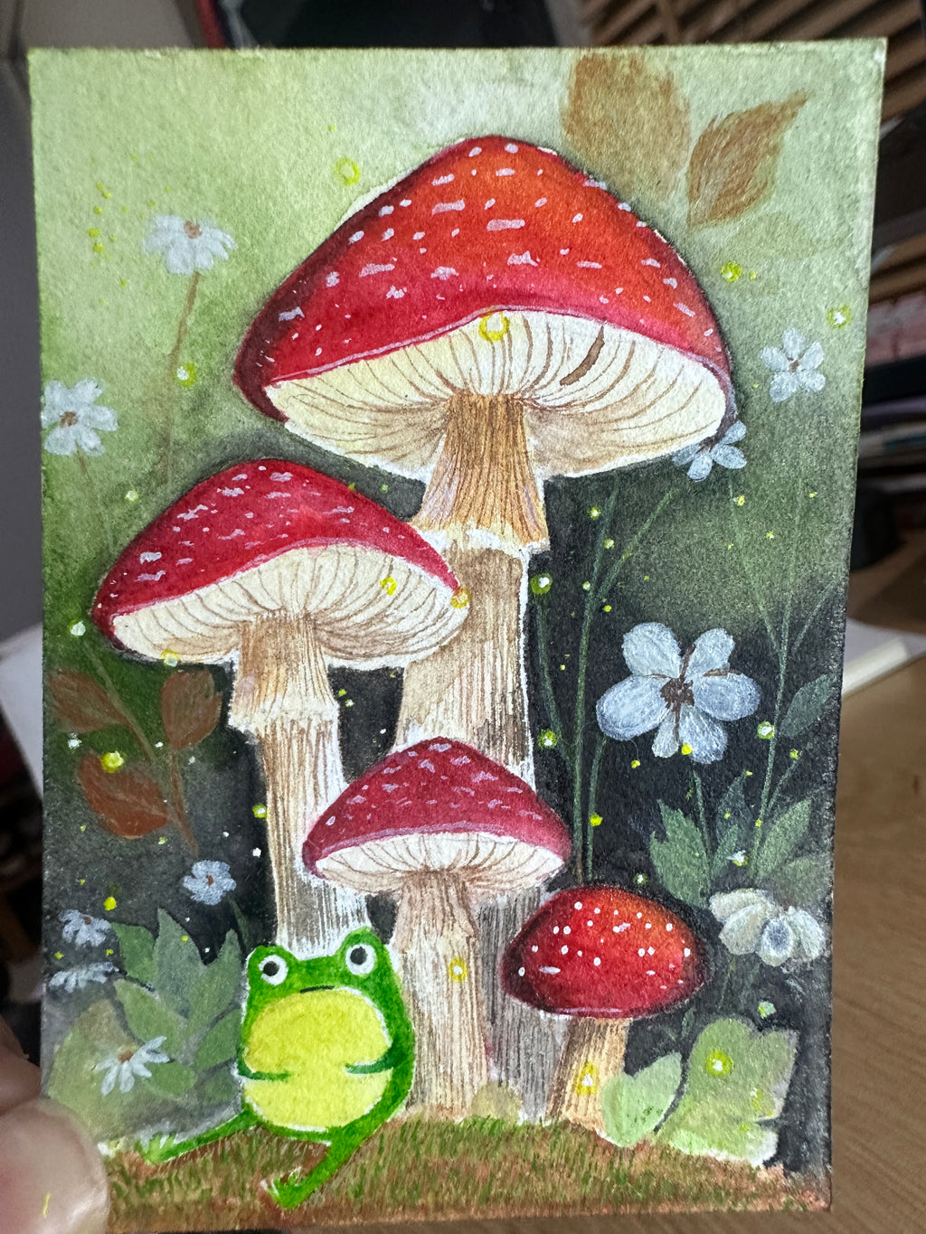 Original ACEO watercolor and gouache painting of a frog among toadstool mushrooms, alternate angle